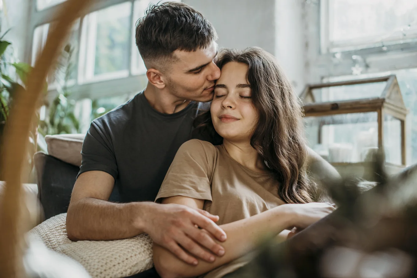 Affectionate adult couple illustrating meaningful connections through the PositiveSingles mobile dating app